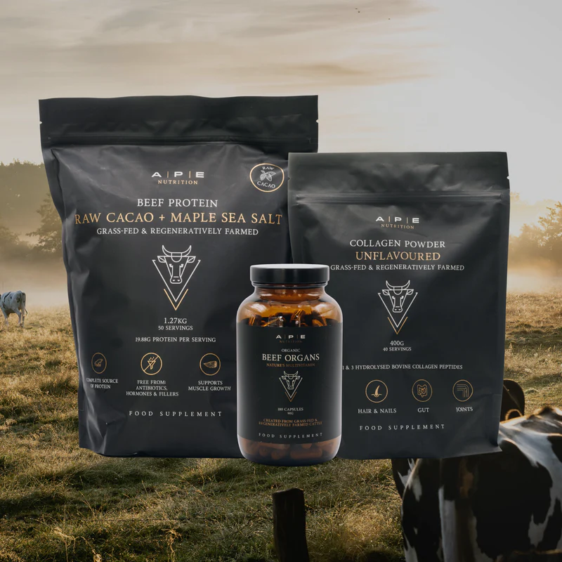 Ape Nutrition Foundation Bundle — beef protein, collagen powder and beef organs capsules in a sunlit Swedish pasture with grass-fed cattle