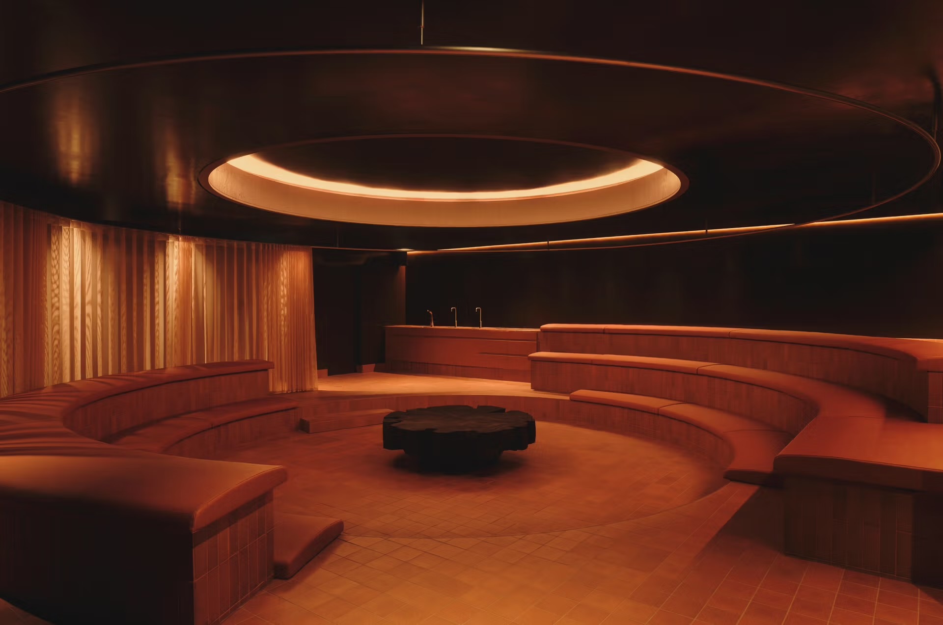 Arc Sauna interior with warm amber lighting
