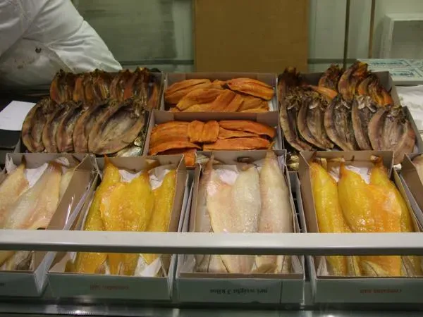 Billingsgate Market — trays of smoked haddock and kippers laid out on a stall