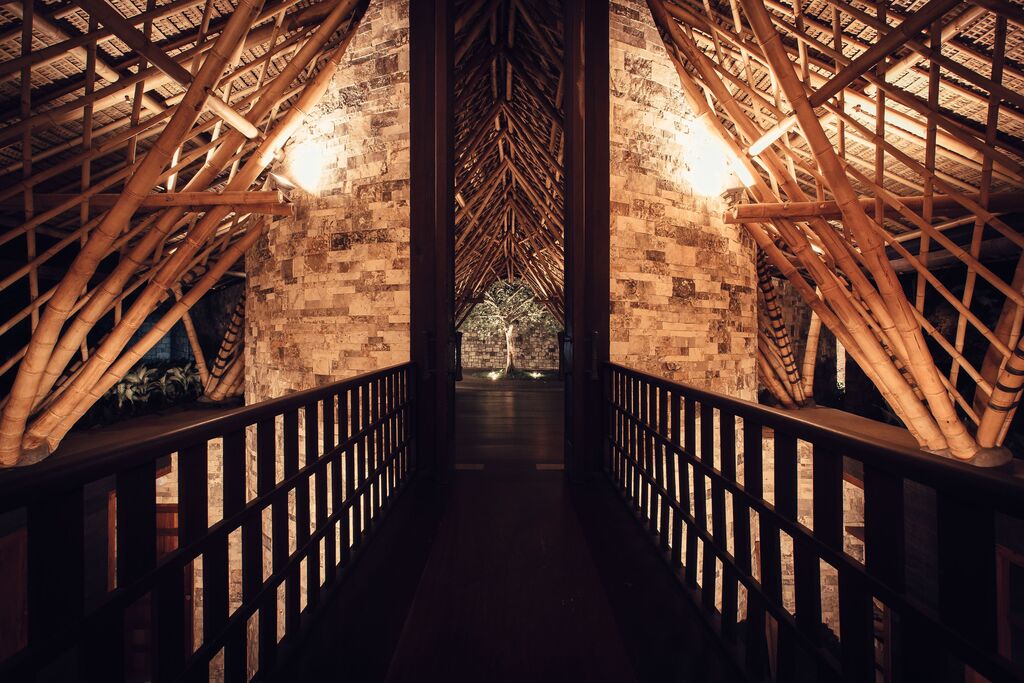 Bamboo and stone walkway leading into Dugong restaurant at Suarga Padang Padang