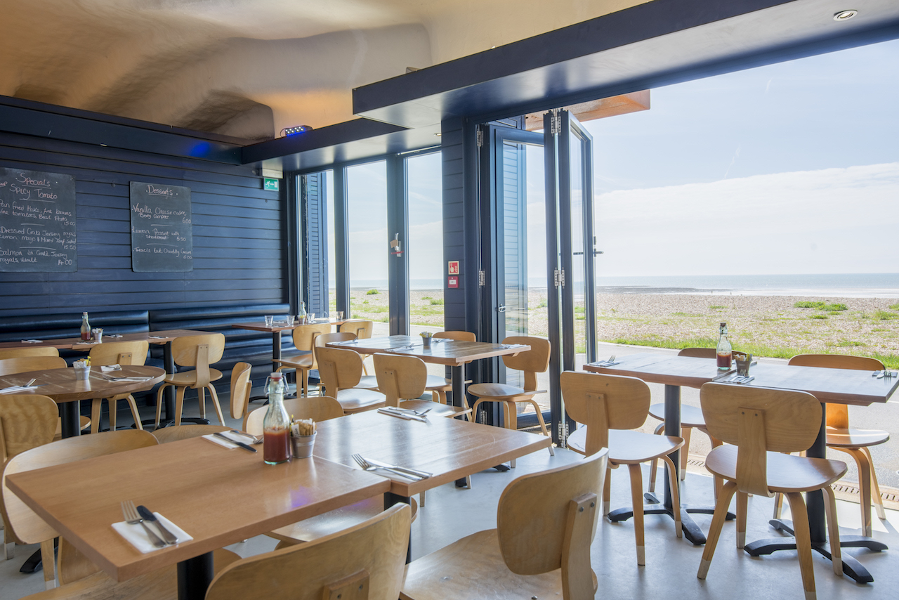 East Beach Café interior with doors open to the beach