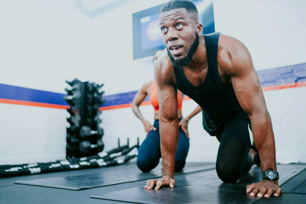 F45 member performing floor exercise during a training session