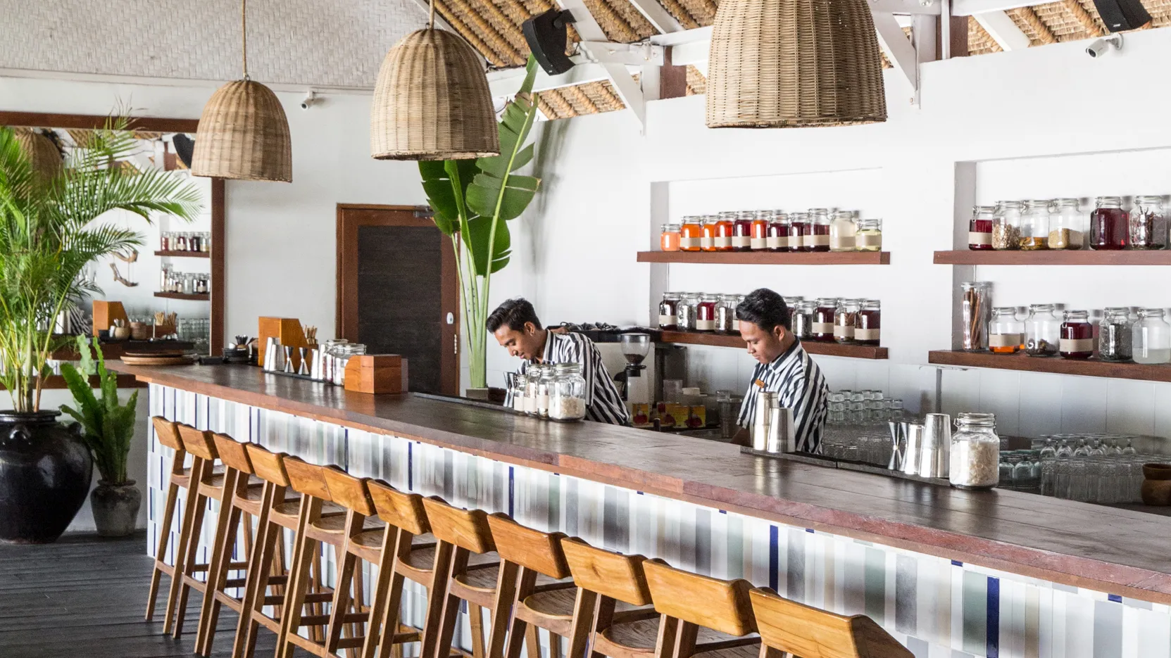 The Lawn Canggu interior bar with rattan pendants