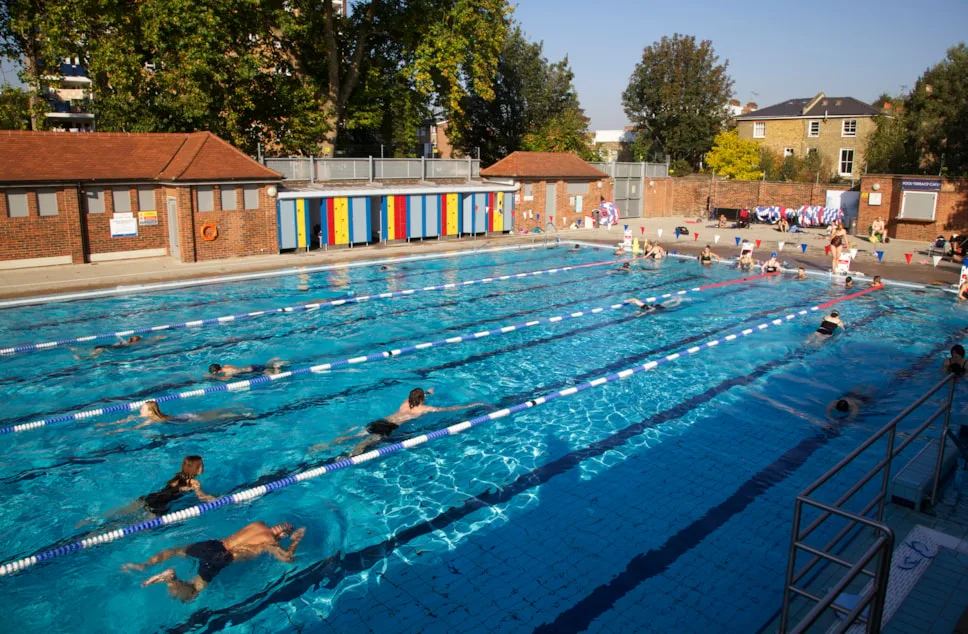 London Fields Lido — marked lanes across the fifty-metre pool early in the morning
