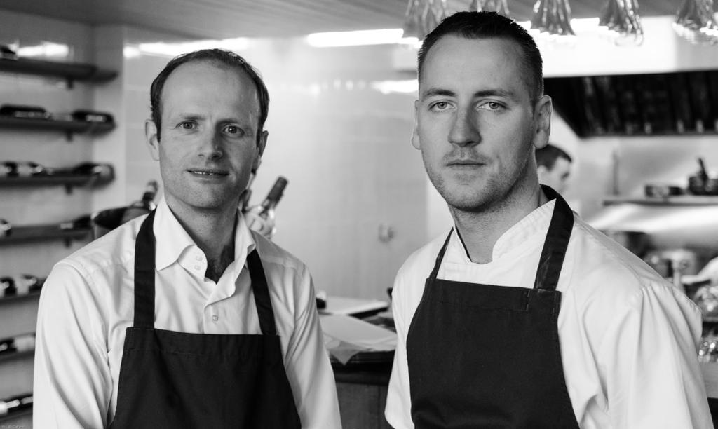 Black and white portrait of Ox Belfast co-owners Alain Kerloc'h and chef Stephen Toman in the kitchen
