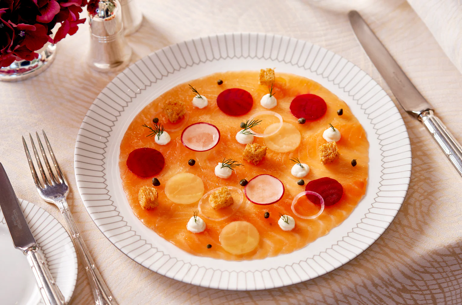 Cured salmon carpaccio plated on Richard Brendon fine bone china with beetroot and radish garnishes