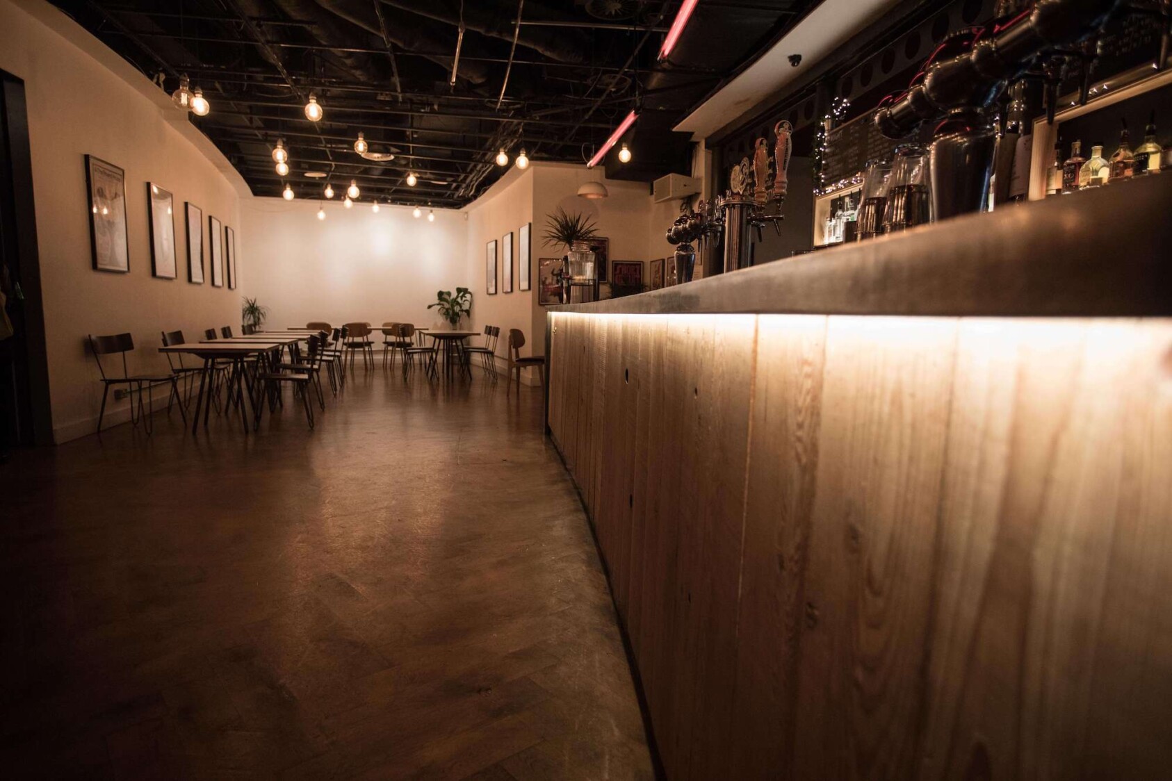 The Roundhouse bar area with curved architecture and warm lighting