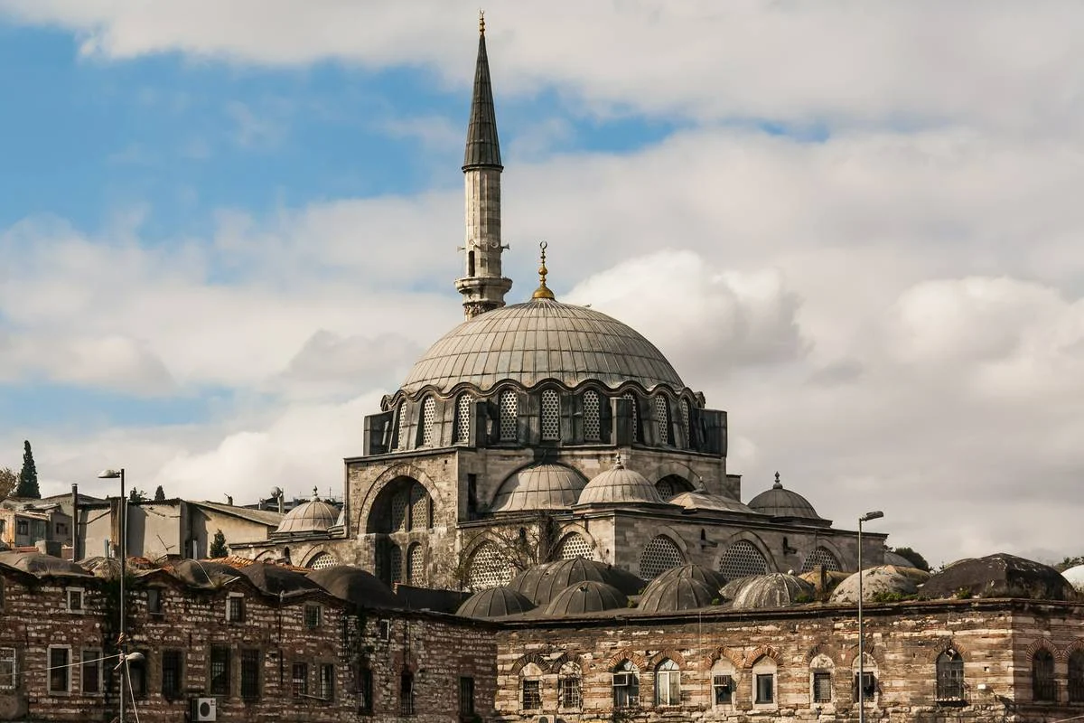 Rüstem Pasha Mosque, Istanbul — the lead dome and single minaret rising above the rooftops of Tahtakale