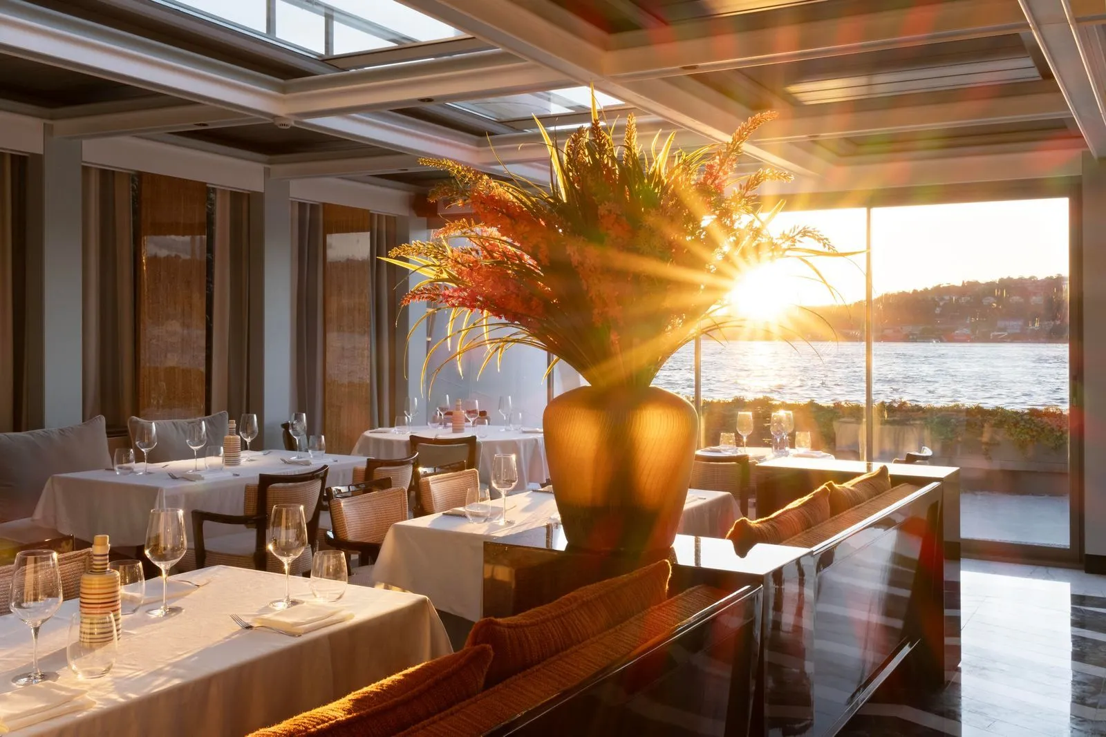 Vakko Hotel Sümahan Bosphorus — the waterside restaurant at sunset, tables set against the Bosphorus