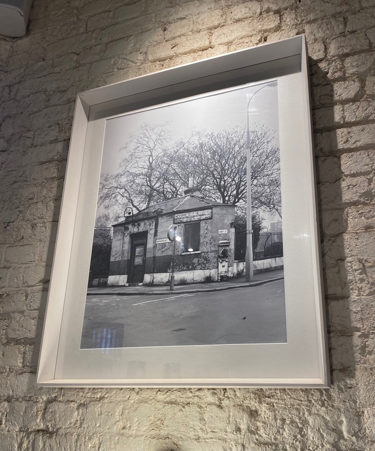 Framed black and white photograph of the original watch house building on Bermondsey Street